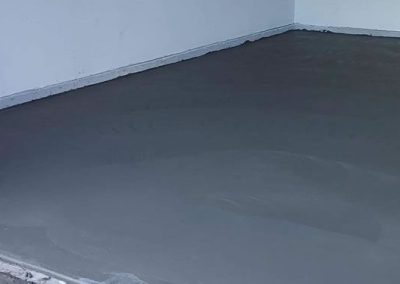 a freshly poured concrete garage floor
